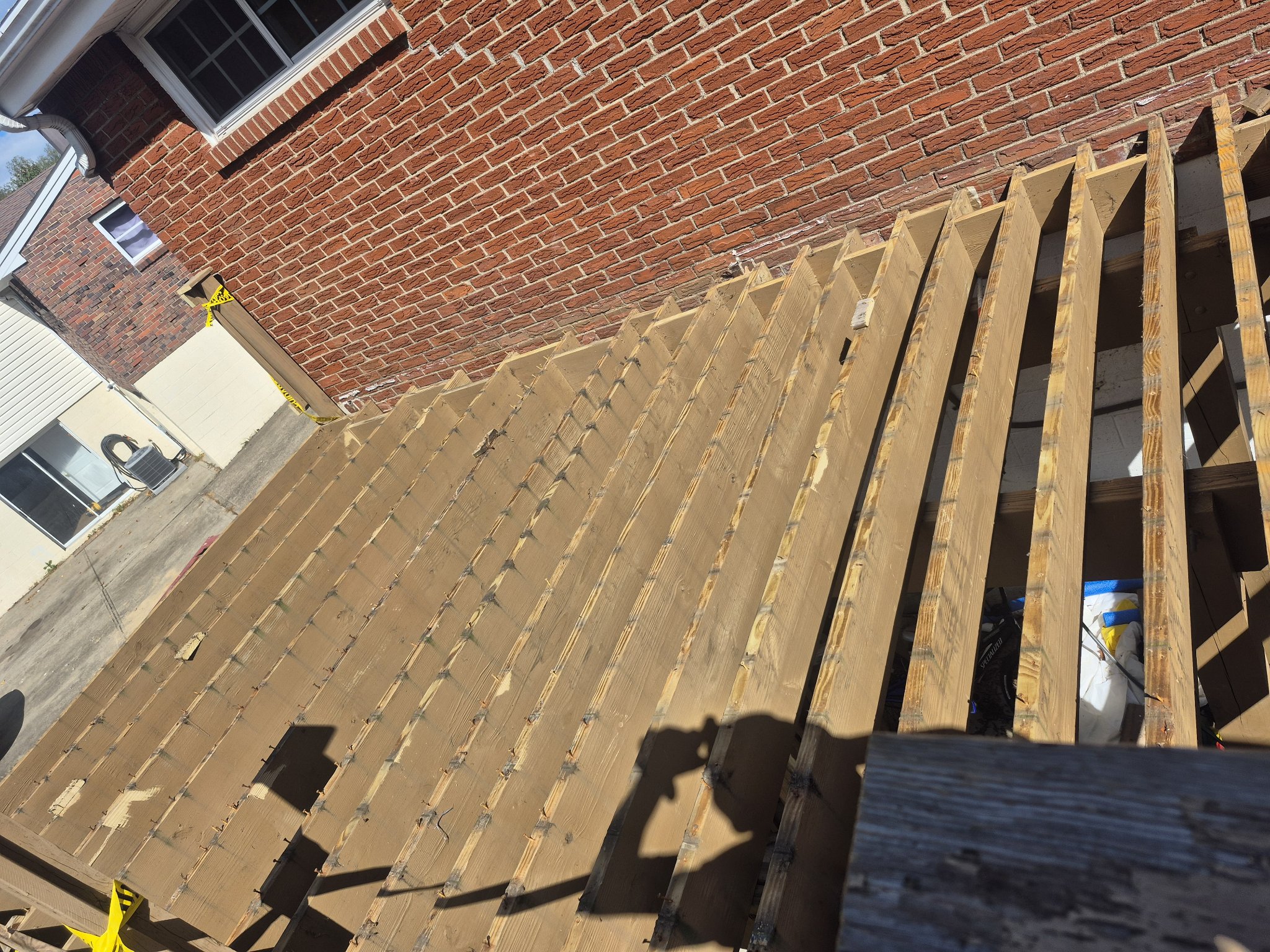 Deck stripped to joists during composite rebuild