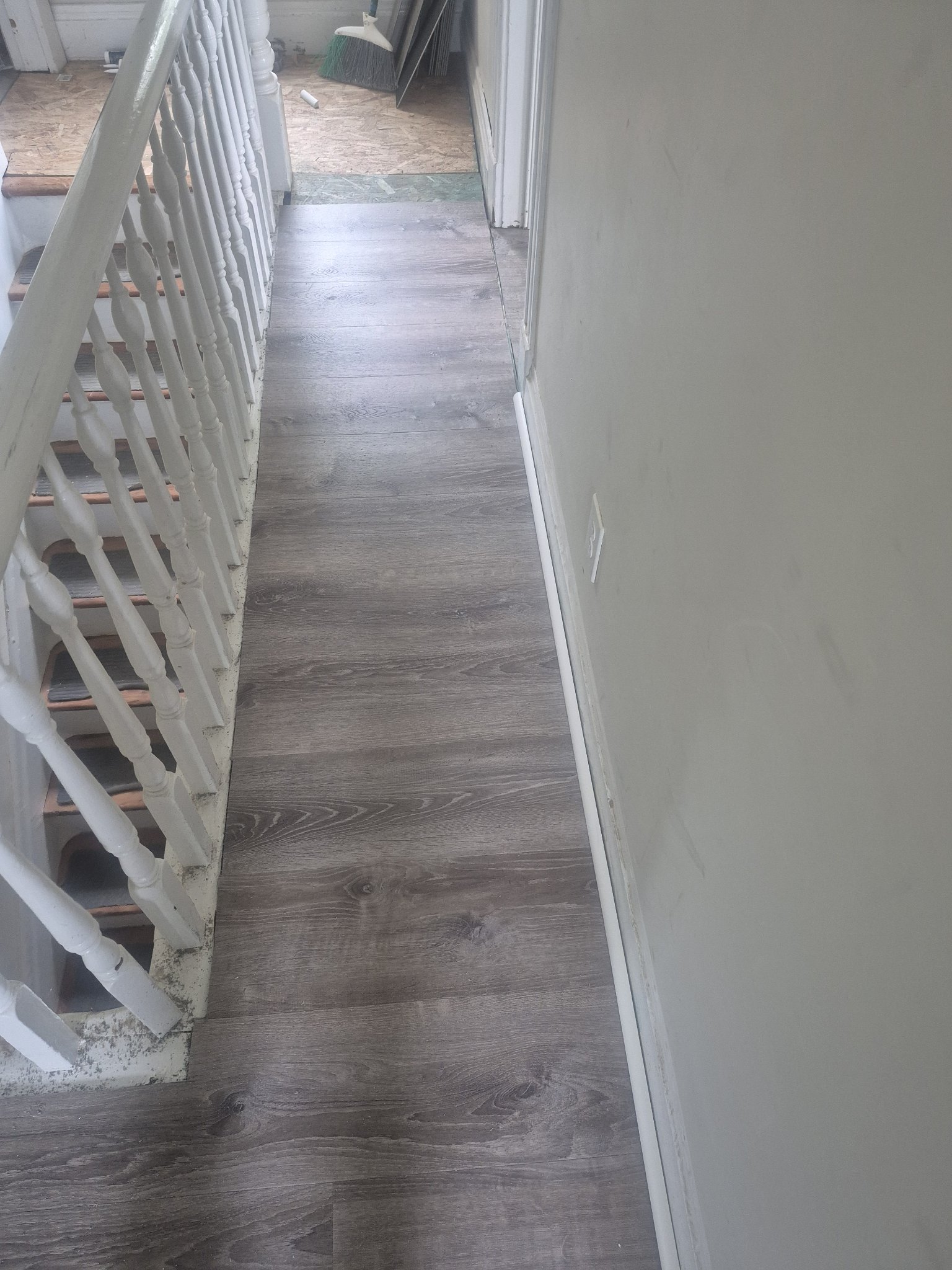 New flooring installed over replaced subfloor in hallway